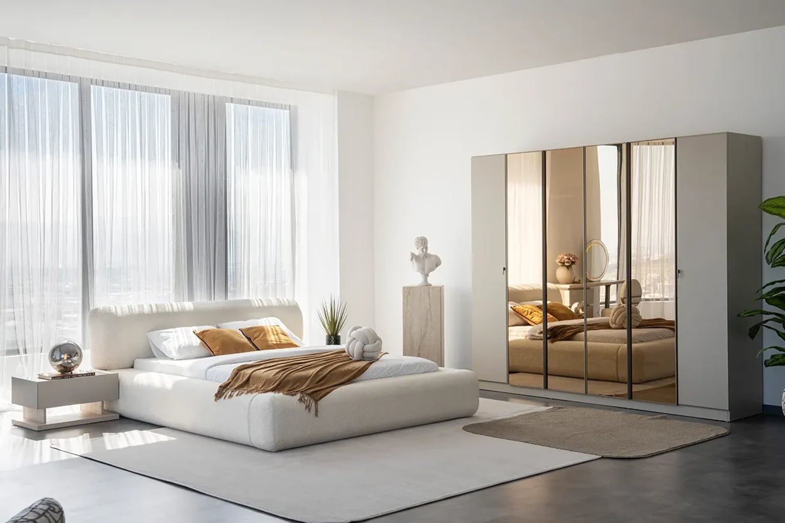 Nötr ve pastel tonlarda dekore edilmiş, doğal ahşap detaylara sahip, huzurlu ve modern bir yatak odası. Yatak, komodinler ve tekstil ürünleri dinlendirici bir atmosfer yaratıyor.